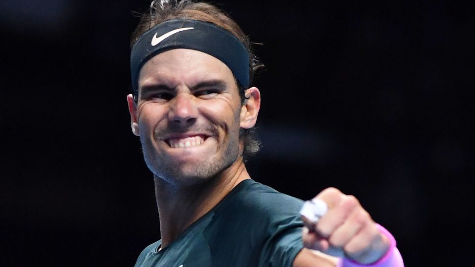 A picture containing person, athletic game, sport, tennis
Description automatically generated