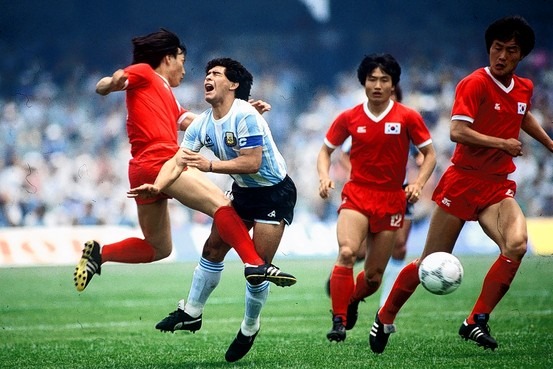 A group of people playing football

Description automatically generated with medium confidence